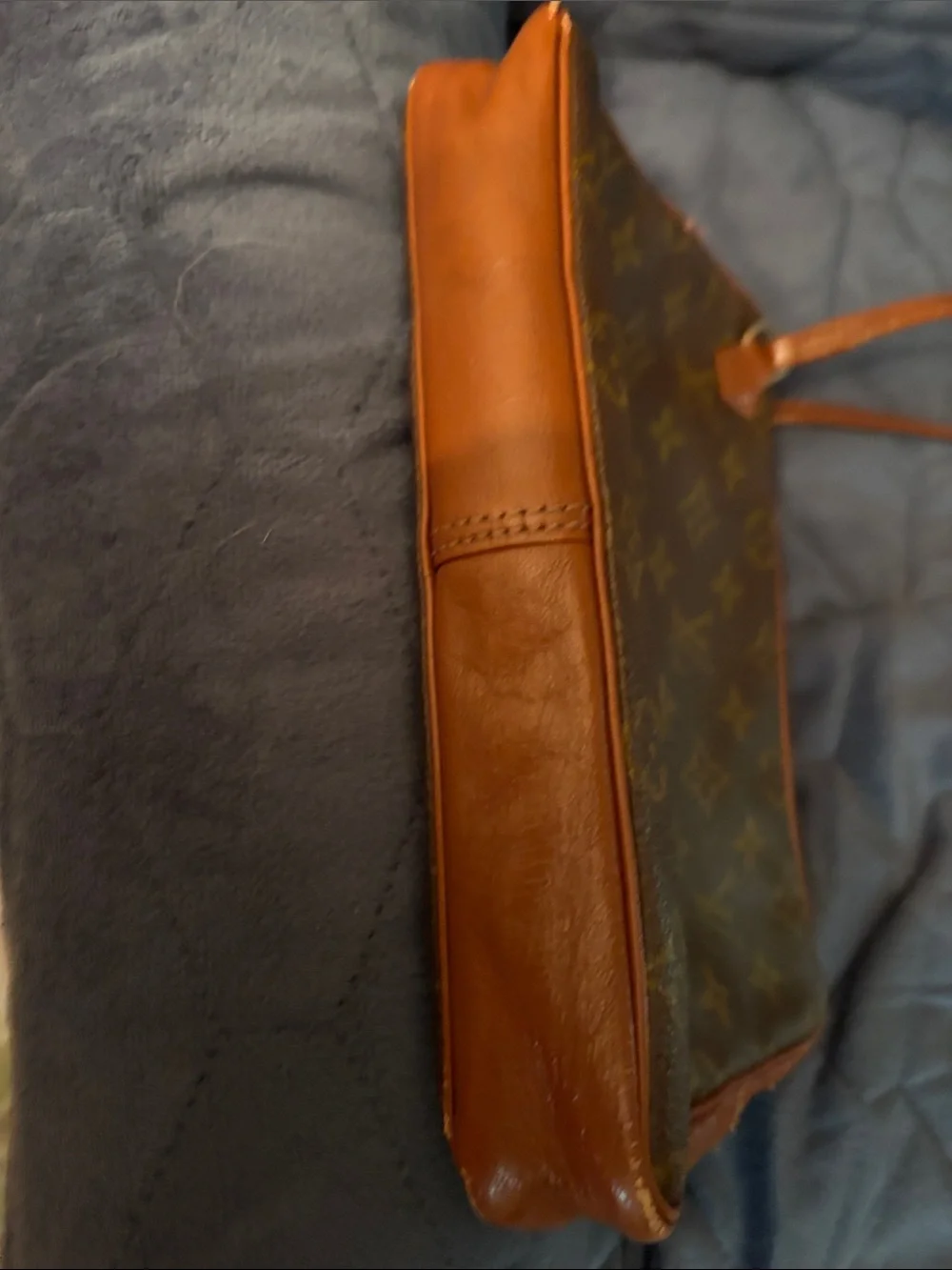 Louis Vuitton Brown Leather Monogram cosmetic case with wristlet strap.